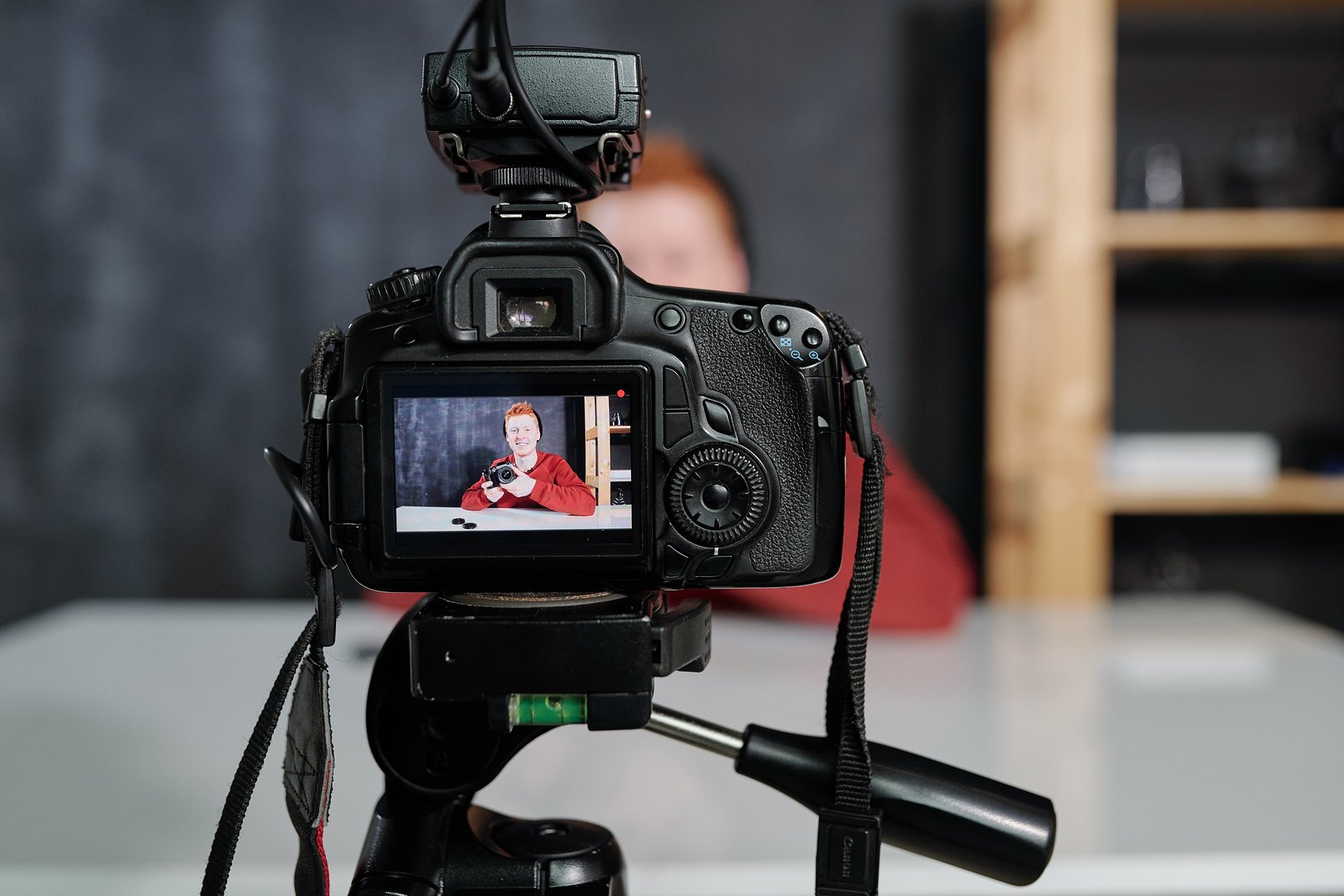 Video camera being used to create video series to connect with remote audience.
